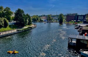 a river with boats and buildings