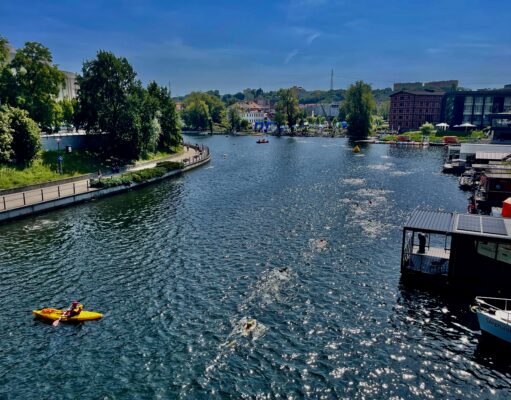 a river with boats and buildings