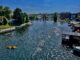 a river with boats and buildings